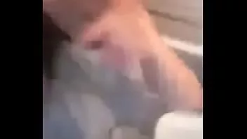 Play American girl recording herself in the bathroom
